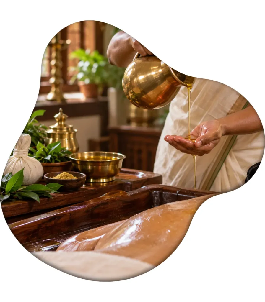 Warm medicated herbal oil being poured into an Ayurvedic therapist's hands before a traditional Abhyangam massage at Nivera Ayur Care in Kochi, Kerala.